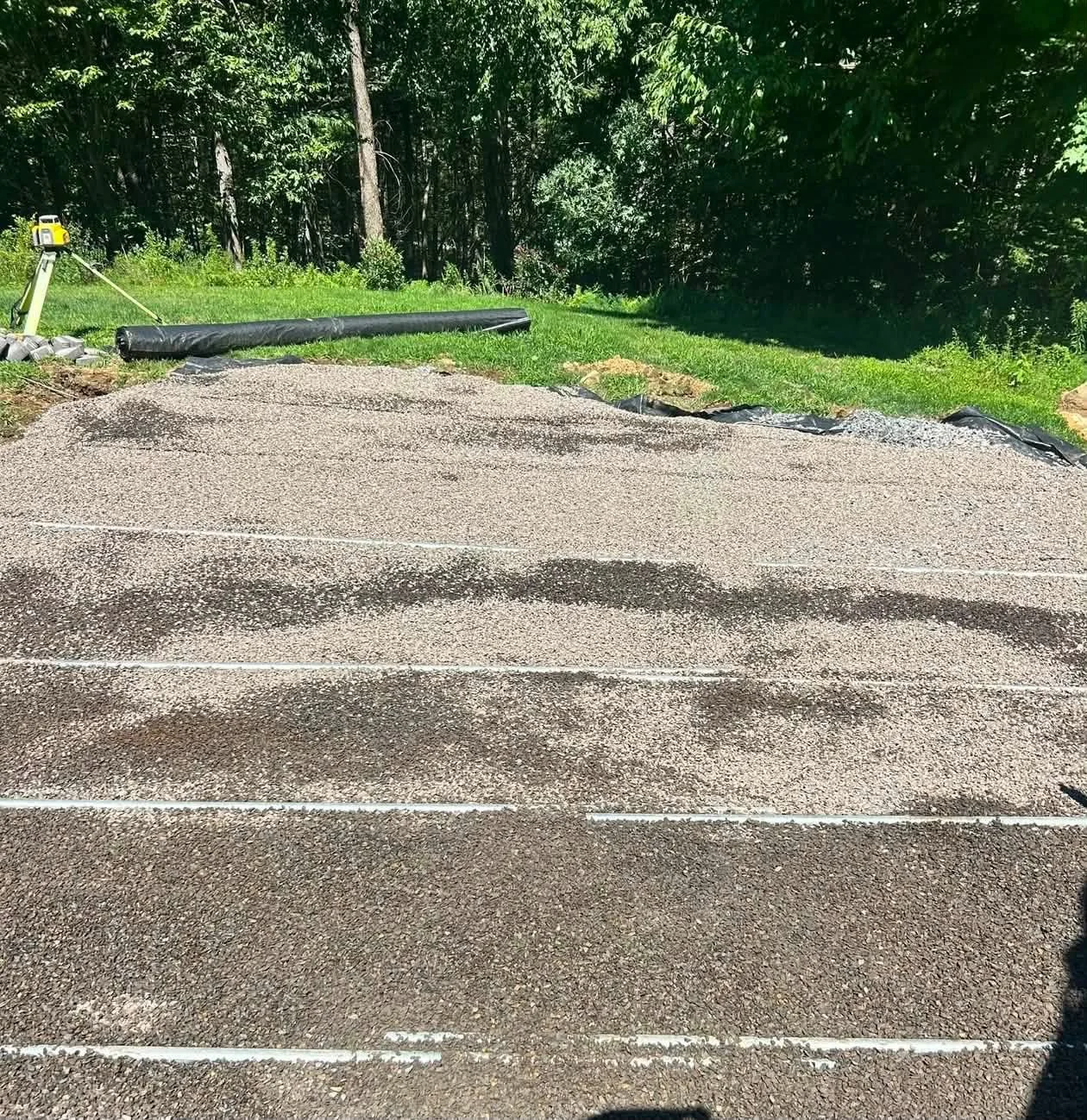 Graded gravel base with string lines set before the patio was built