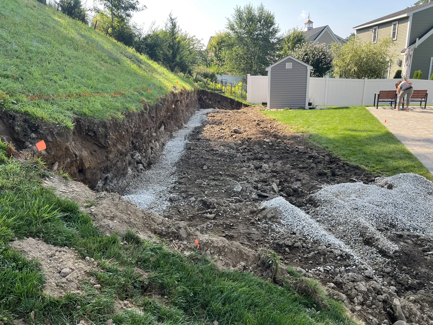 Crushed stone base laid along the length of a cut into a hillside