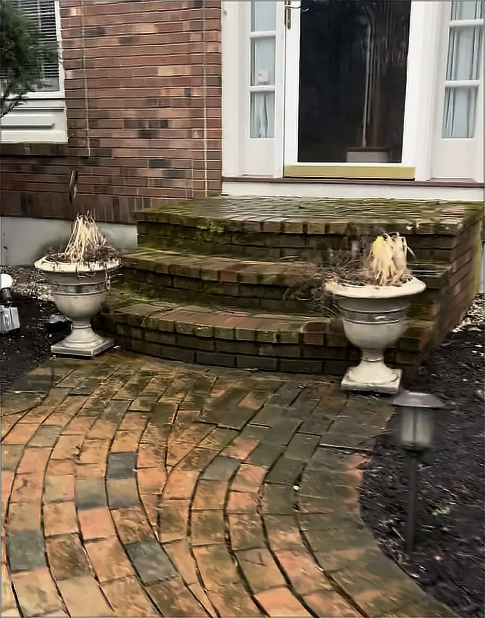 Cracked, settled brick walkway and steps before the rebuild