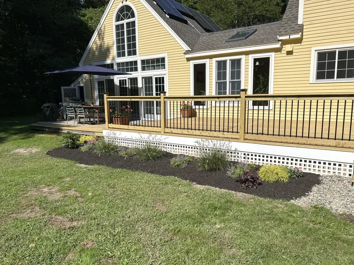 Easy care plants set along the front of a new deck