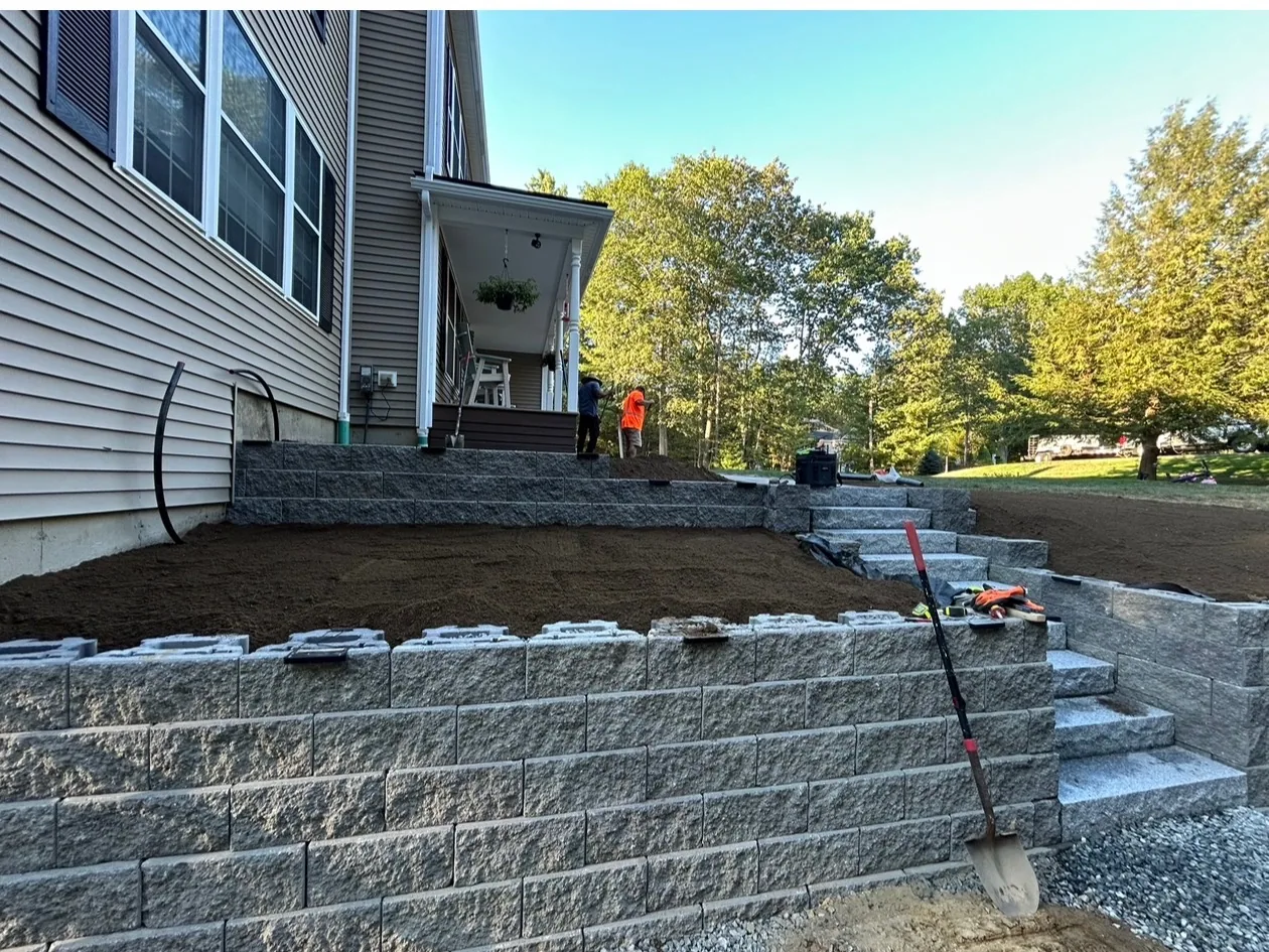 Compacted gravel base going in before the surface is set